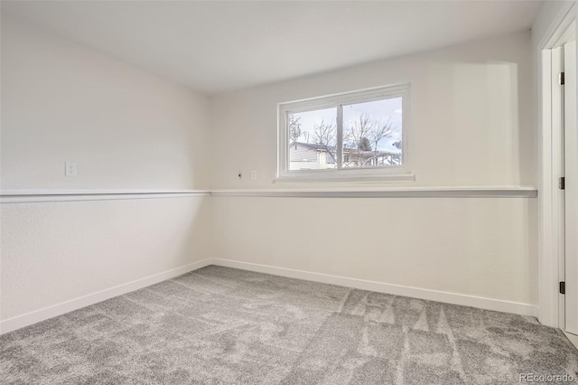 unfurnished room with carpet flooring