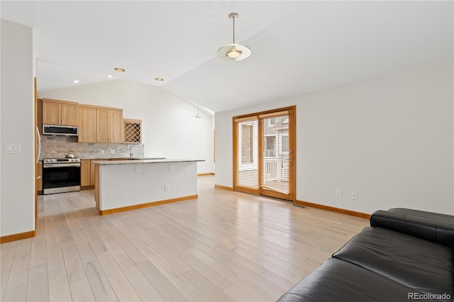 kitchen featuring open floor plan, lofted ceiling, range hood, backsplash, and appliances with stainless steel finishes