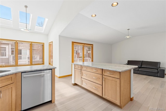 kitchen with dishwasher, light brown cabinets, vaulted ceiling with skylight, and light wood-type flooring