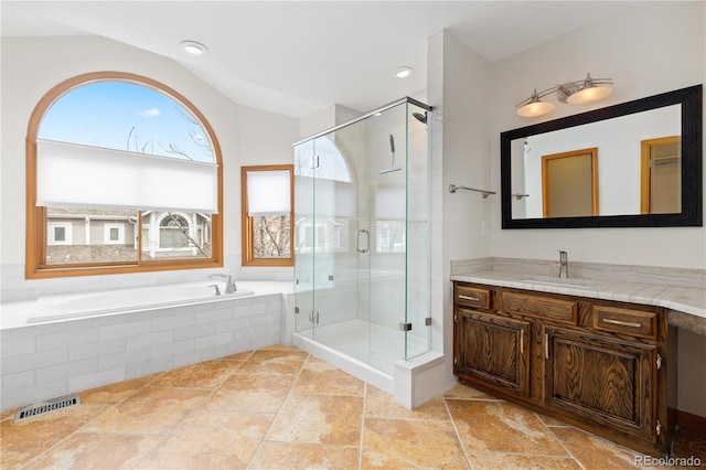 full bath featuring a stall shower, visible vents, lofted ceiling, and a bath
