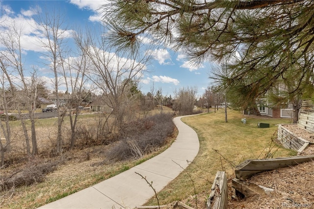 surrounding community featuring a yard