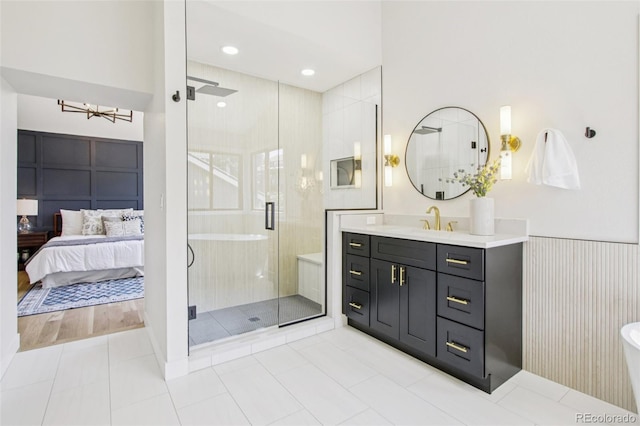 9810 Venneford Ranch Rd, Highlands Ranch, CO 80126 - full bathroom with a stall shower, vanity, a chandelier, tile patterned floors, and recessed lighting