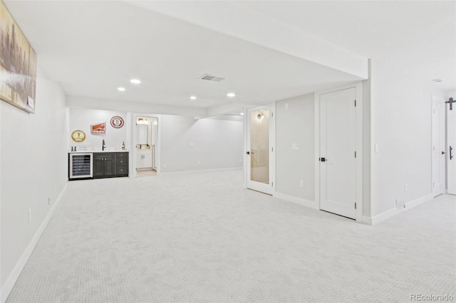 9810 Venneford Ranch Rd, Highlands Ranch, CO 80126 - finished basement with wine cooler, light colored carpet, bar, and recessed lighting