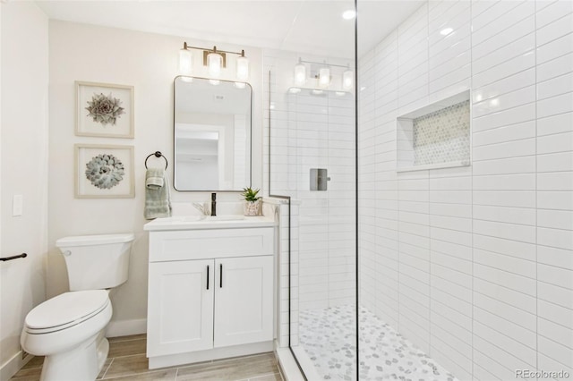 9810 Venneford Ranch Rd, Highlands Ranch, CO 80126 - bathroom with vanity, a tile shower, and wood finished floors