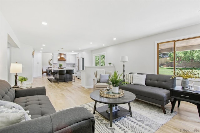 9810 Venneford Ranch Rd, Highlands Ranch, CO 80126 - living area with recessed lighting and light wood-style flooring