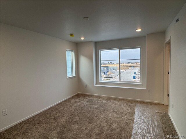 view of carpeted spare room