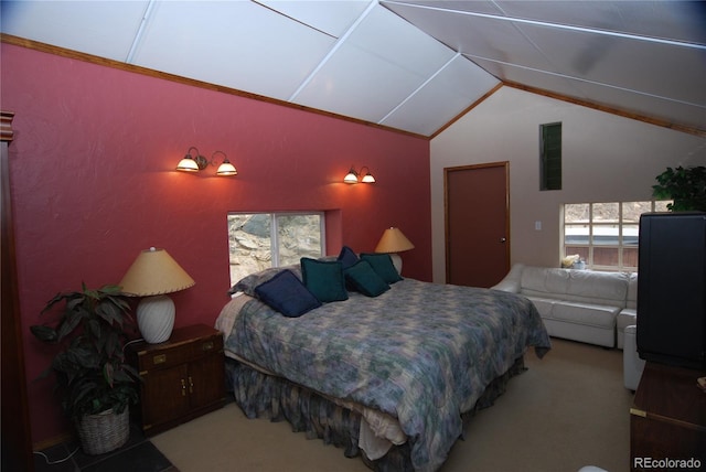 carpeted bedroom featuring lofted ceiling