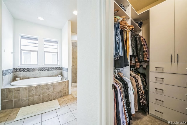 walk in closet featuring light tile patterned floors