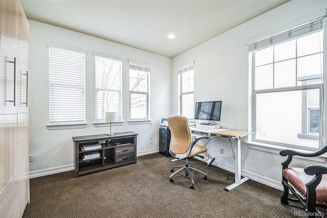 office space featuring baseboards, dark carpet, and recessed lighting