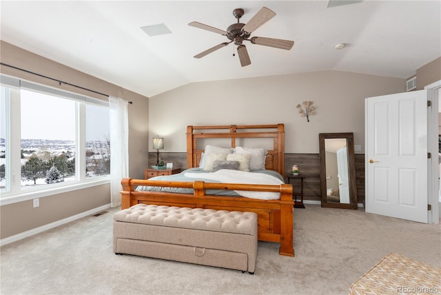 bedroom with ceiling fan, lofted ceiling, and light carpet