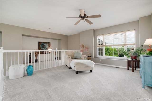 living area with ceiling fan and carpet floors