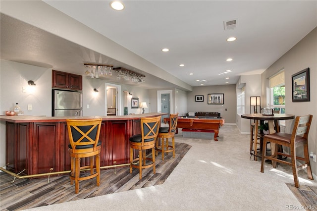 bar featuring carpet flooring, stainless steel fridge, and pool table