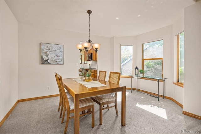 6506 S Robb Way, Littleton, CO 80127 - dining room featuring light colored carpet and a chandelier