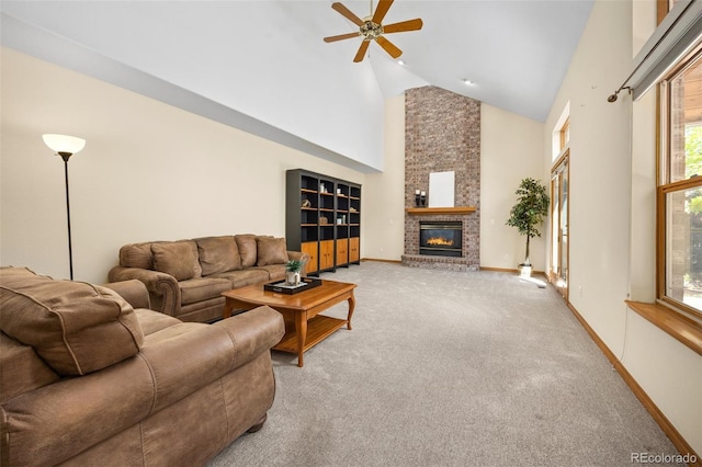 6506 S Robb Way, Littleton, CO 80127 - living area featuring high vaulted ceiling, ceiling fan, a fireplace, and carpet flooring