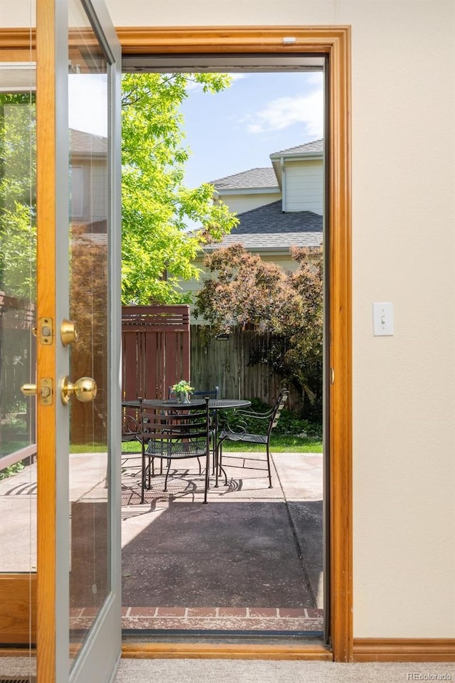 6506 S Robb Way, Littleton, CO 80127 - doorway to outside with baseboards