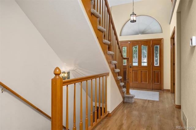 6506 S Robb Way, Littleton, CO 80127 - entrance foyer with wood finished floors and stairway