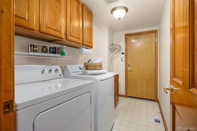 6506 S Robb Way, Littleton, CO 80127 - washroom featuring cabinet space, light flooring, and washer and dryer