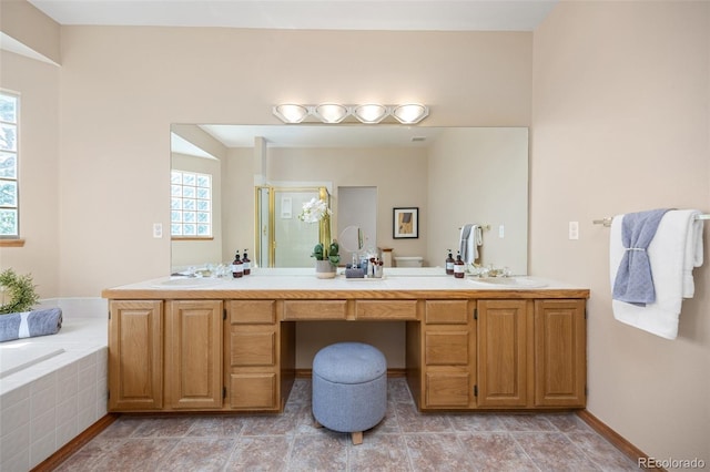 6506 S Robb Way, Littleton, CO 80127 - bathroom featuring double vanity, a bath, and a shower stall