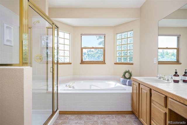 6506 S Robb Way, Littleton, CO 80127 - full bath featuring a bath, vanity, and a shower stall