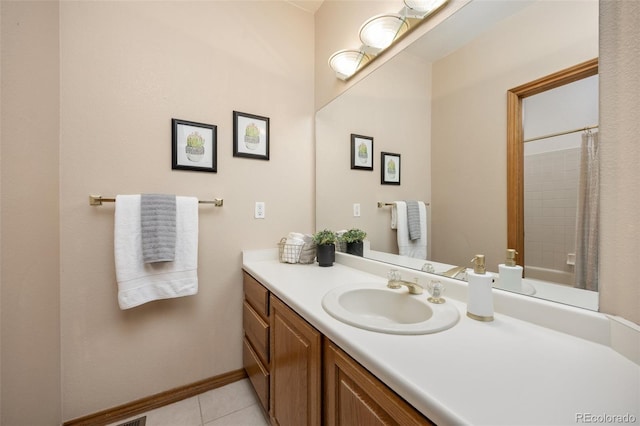 6506 S Robb Way, Littleton, CO 80127 - full bath with vanity, tile patterned flooring, and a shower with shower curtain