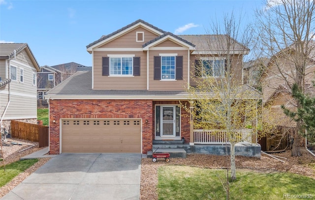 24880 E Euclid Pl, Aurora, CO 80016 - view of front of house featuring a tile roof, driveway, fence, brick siding, and an attached garage