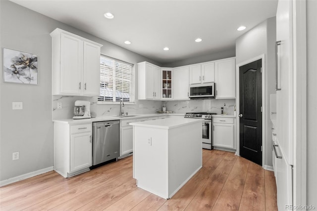 24880 E Euclid Pl, Aurora, CO 80016 - kitchen featuring light countertops, recessed lighting, stainless steel appliances, and a sink