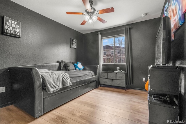 24880 E Euclid Pl, Aurora, CO 80016 - bedroom with hardwood / wood-style flooring, ceiling fan, and a textured wall