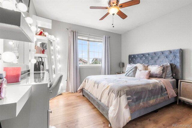 24880 E Euclid Pl, Aurora, CO 80016 - bedroom with light wood-type flooring and a ceiling fan