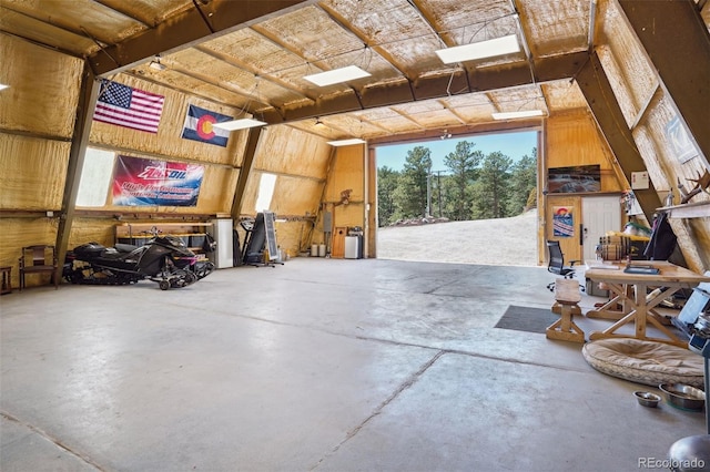 garage featuring wooden walls