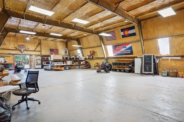 garage featuring wooden walls