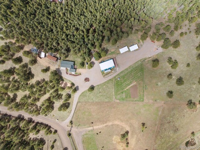 birds eye view of property with a rural view