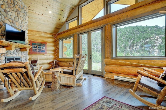sitting room featuring wood ceiling, high vaulted ceiling, a healthy amount of sunlight, and log walls