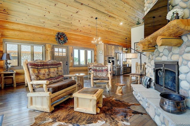 living room with a fireplace, high vaulted ceiling, a notable chandelier, dark hardwood / wood-style flooring, and wood ceiling