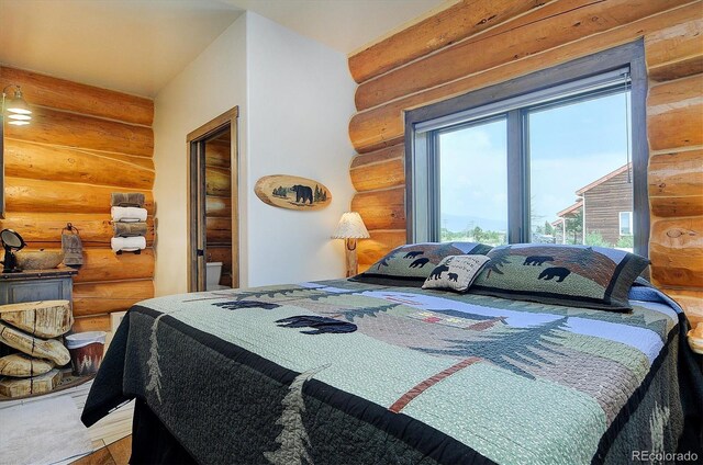 bedroom featuring rustic walls