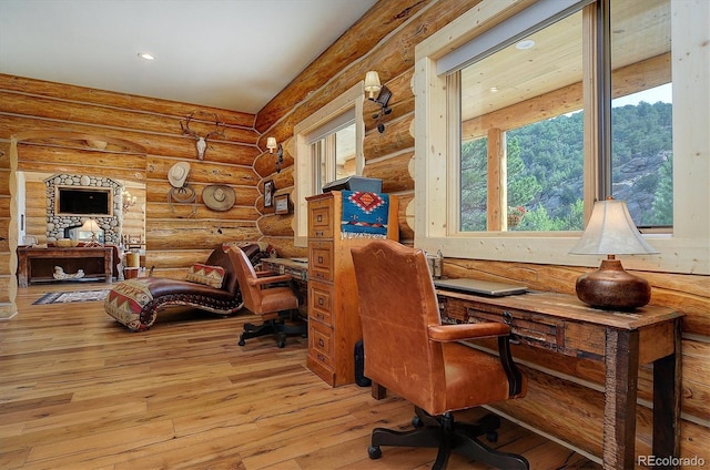 office area with hardwood / wood-style flooring, recessed lighting, and log walls