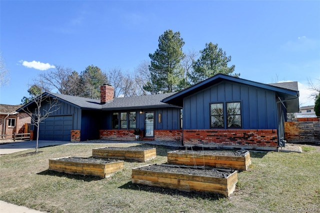 view of front of house featuring a garden, an attached garage, board and batten siding, and a chimney