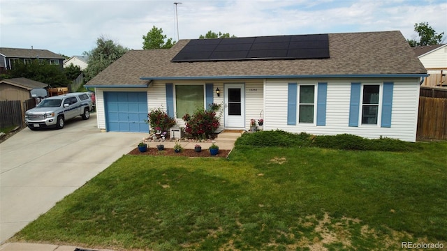19258 E Kansas Dr, Aurora, CO 80017 - view of front of property featuring a shingled roof, concrete driveway, solar panels, and an attached garage