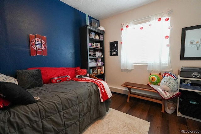 19258 E Kansas Dr, Aurora, CO 80017 - bedroom with multiple windows and wood finished floors