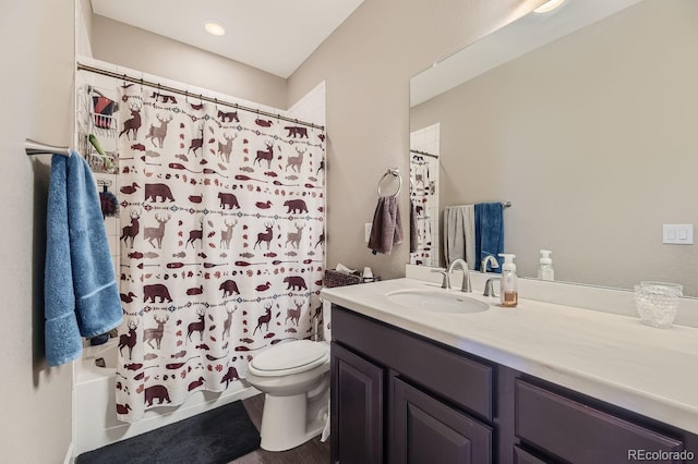 full bathroom featuring vanity, toilet, wood-type flooring, and shower / tub combo with curtain