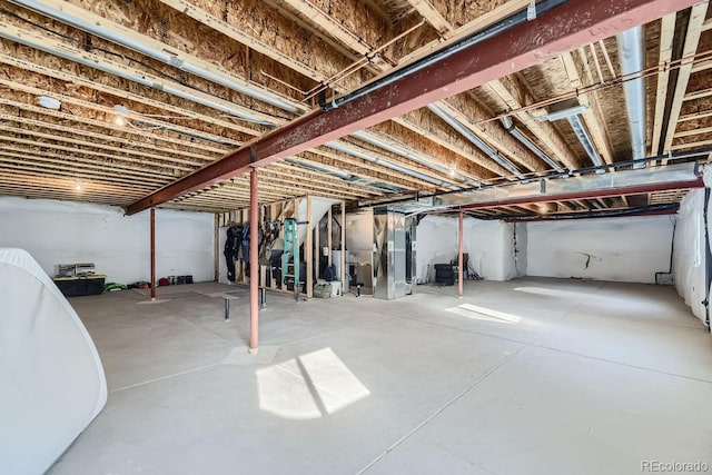 basement featuring heating unit