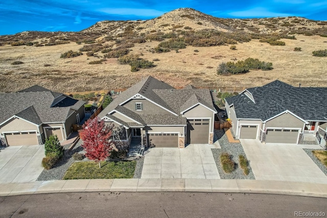 birds eye view of property featuring a mountain view