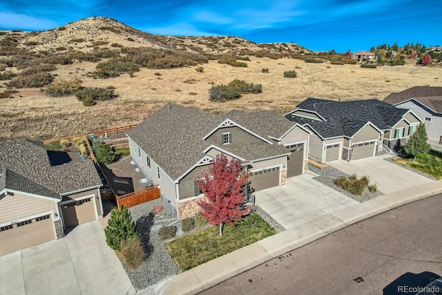 birds eye view of property featuring a mountain view