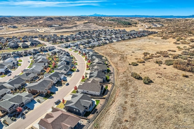 birds eye view of property with a mountain view