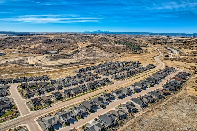 birds eye view of property featuring a mountain view