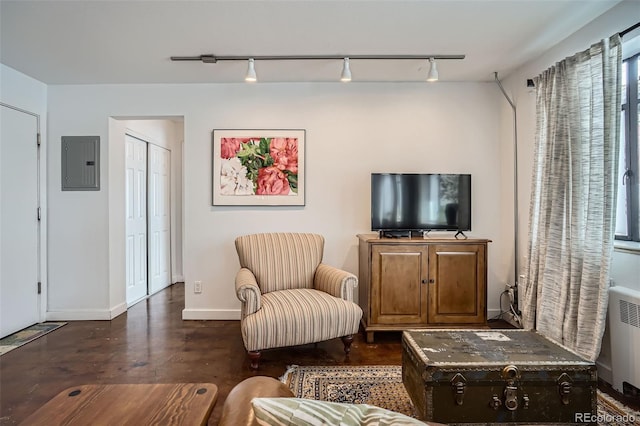 500 E 11th Ave Unit 205, Denver, CO 80203 - living area with electric panel, track lighting, concrete floors, and radiator
