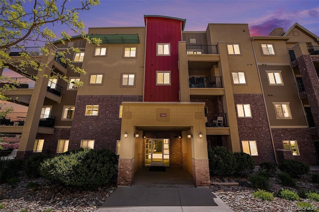 1144 Rockhurst Dr Unit 105, Highlands Ranch, CO 80129 - view of property at dusk