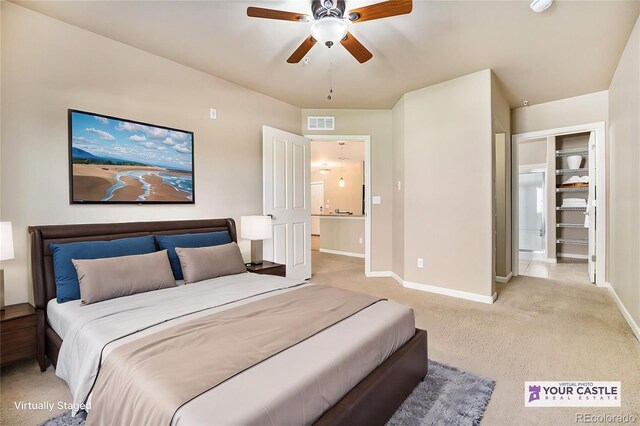 1144 Rockhurst Dr Unit 105, Highlands Ranch, CO 80129 - bedroom featuring baseboards, light colored carpet, and a ceiling fan