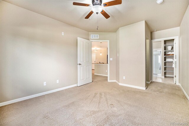1144 Rockhurst Dr Unit 105, Highlands Ranch, CO 80129 - unfurnished bedroom with light colored carpet, baseboards, and a ceiling fan