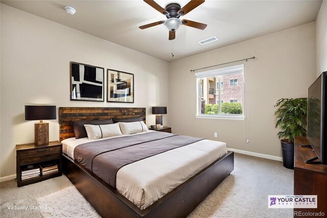 1144 Rockhurst Dr Unit 105, Highlands Ranch, CO 80129 - bedroom with baseboards, light carpet, and a ceiling fan