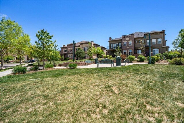 1144 Rockhurst Dr Unit 105, Highlands Ranch, CO 80129 - view of property's community featuring a lawn and a residential view